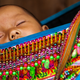 A baby from the Hmong ethnic group.